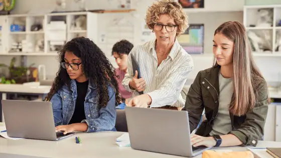 tutor teaching young adult learners in a classroom